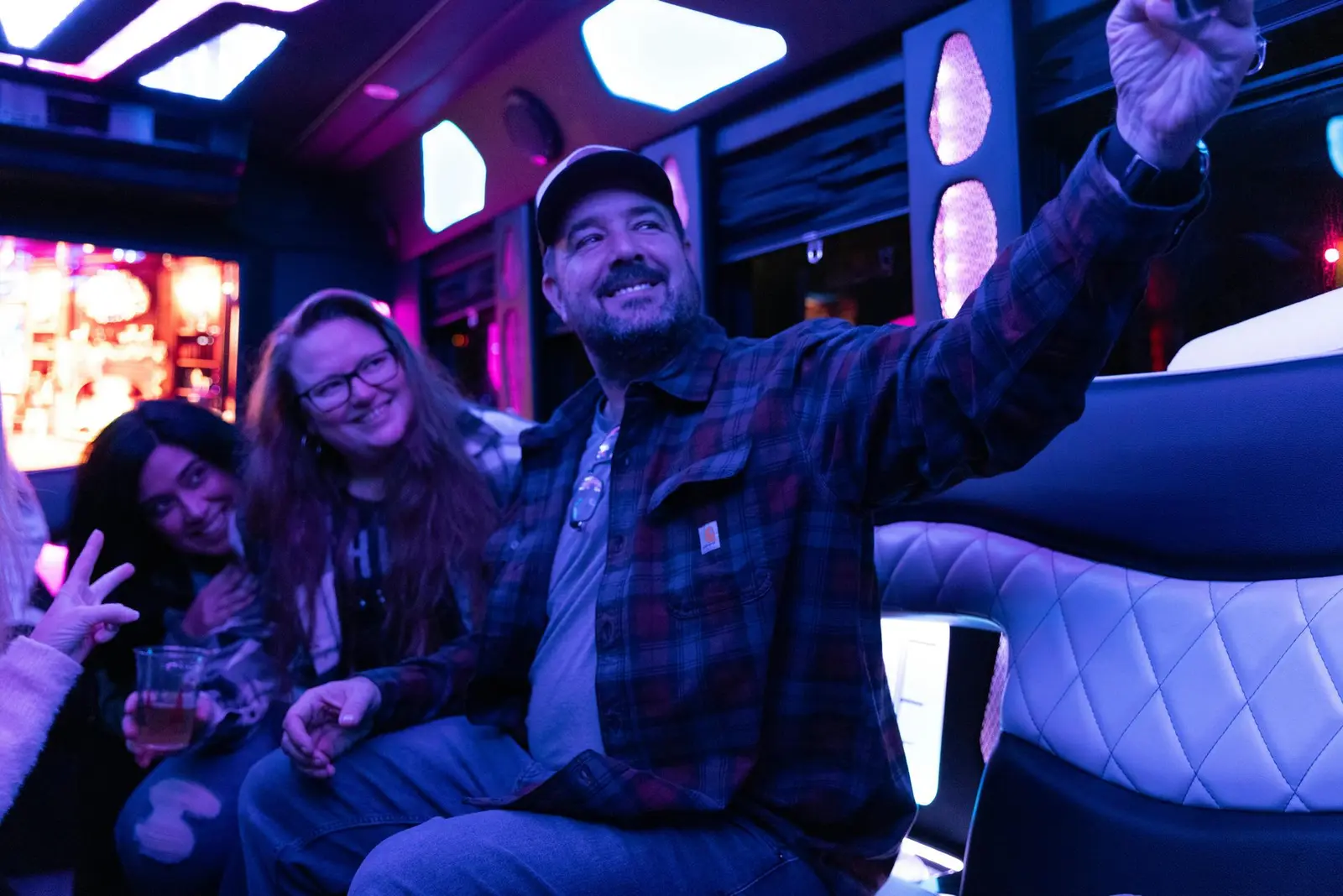 Group celebrating a night out aboard a luxury party bus in Chicago